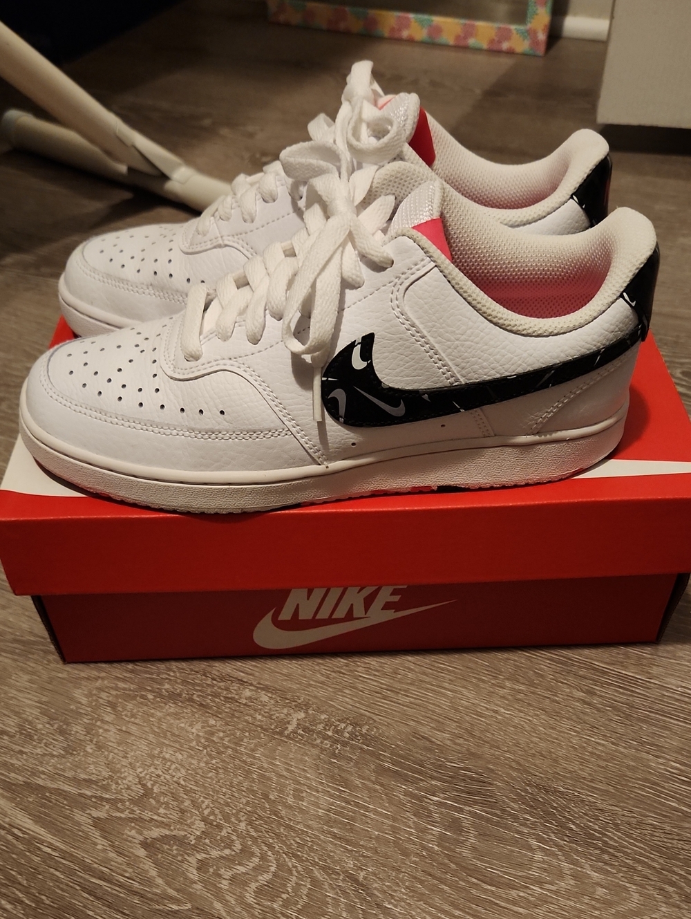 Nike Womens White Low-Top Sneakers with Black Swoosh and Pink Lining